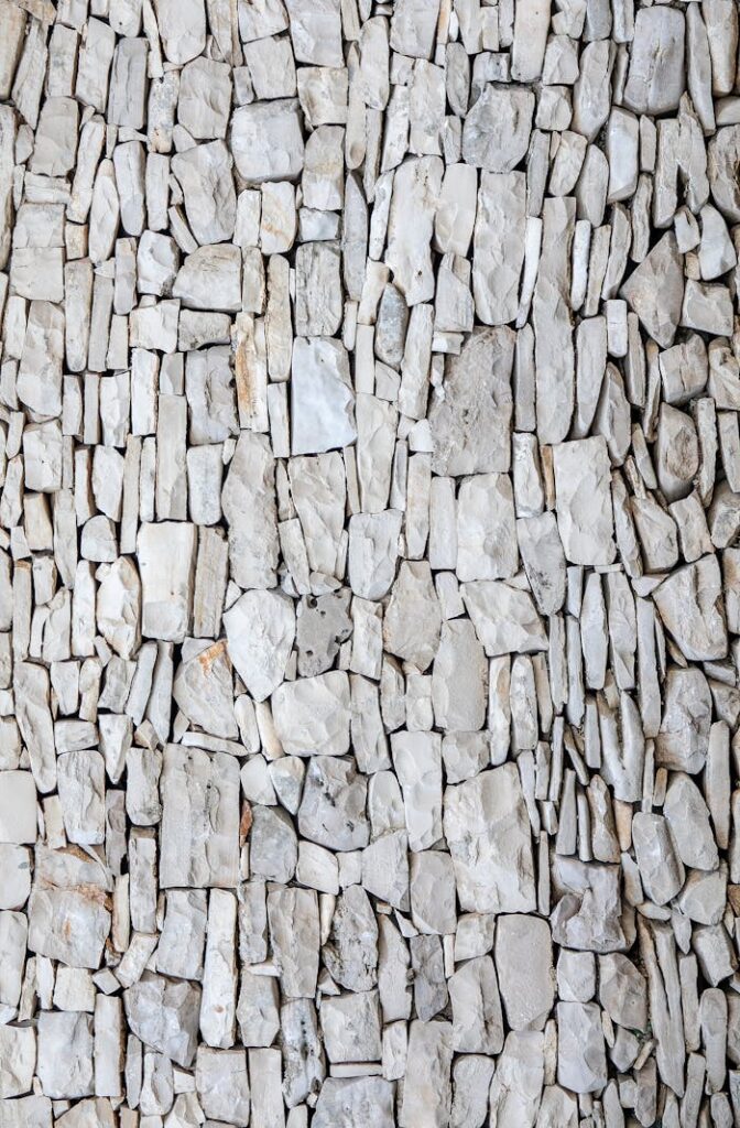 Detailed natural stone wall texture perfect for backgrounds or design materials.