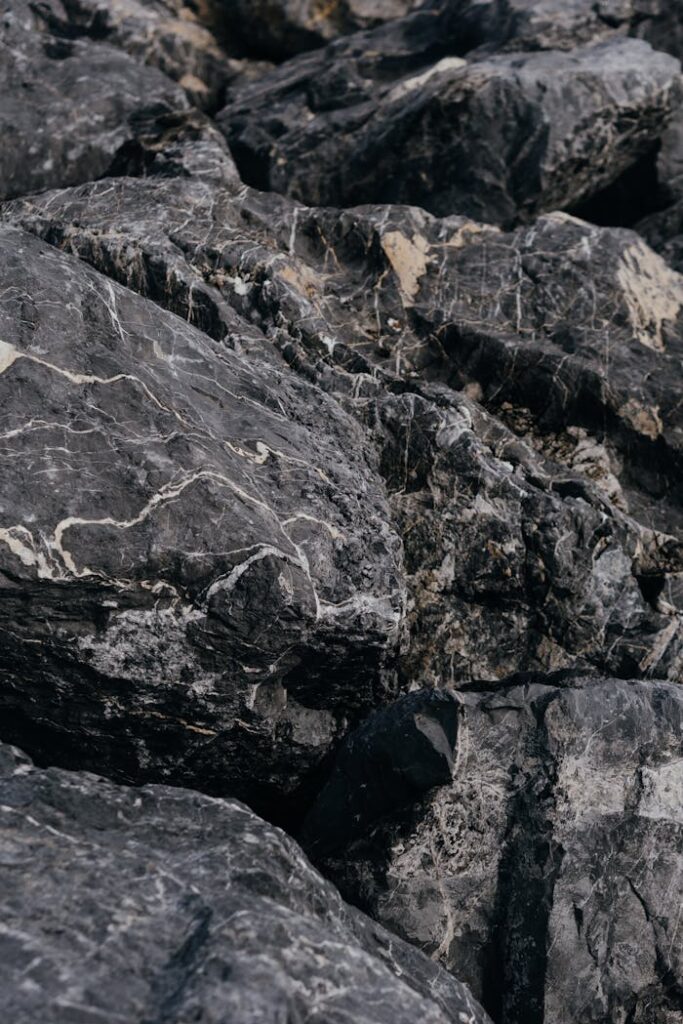 High-resolution close-up of textured gray rocks, showcasing natural patterns and rugged beauty.